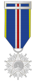 Heraldic insignia of the Member grade.