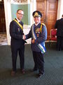 Nicholas of Flandrensis with Kevin Baugh of the Republic of Molossia at the Polination Micronational Conference in London (2012).[1][2][4][5]