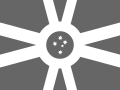 Flag of Bŵl, the Oceanic region of the DRSBI. It has the South Cross in the centre of a grey version of the Regional Flag base. The South Cross is a constellation of stars commonly found on the flags of countries in Oceania.