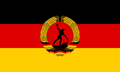 The Flag of the NDDR Rebel Group was designed based on the 1989 proposal for the new flag of East Germany. The flag is now used by the Revolutionary Brigades for ceremonial reasons.