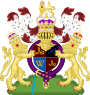 Coat of arms containing shield and crown in centre, flanked by lions