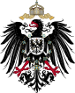 Shield containing a black, one-headed, rightward-looking eagle with red beak, tongue and claws. On its breast is a shield with another eagle. Over its head is an imperial crown with two crossing ribbons.